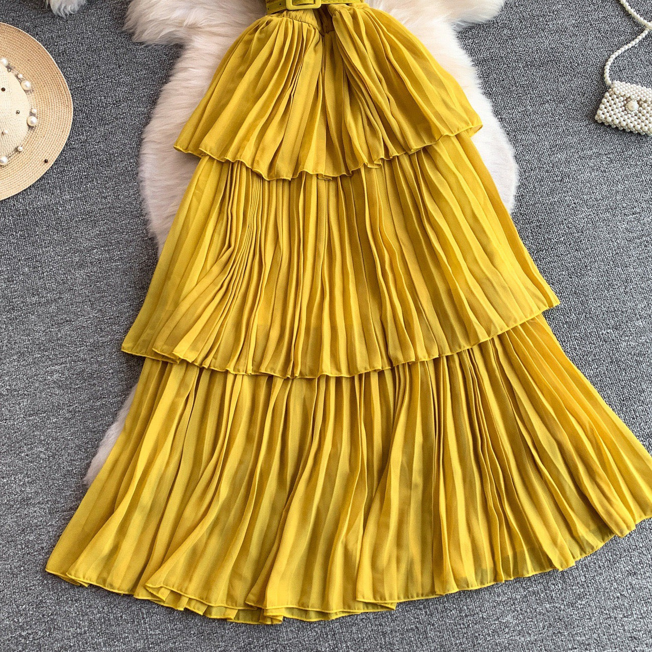Yellow pleated midi dress with belt