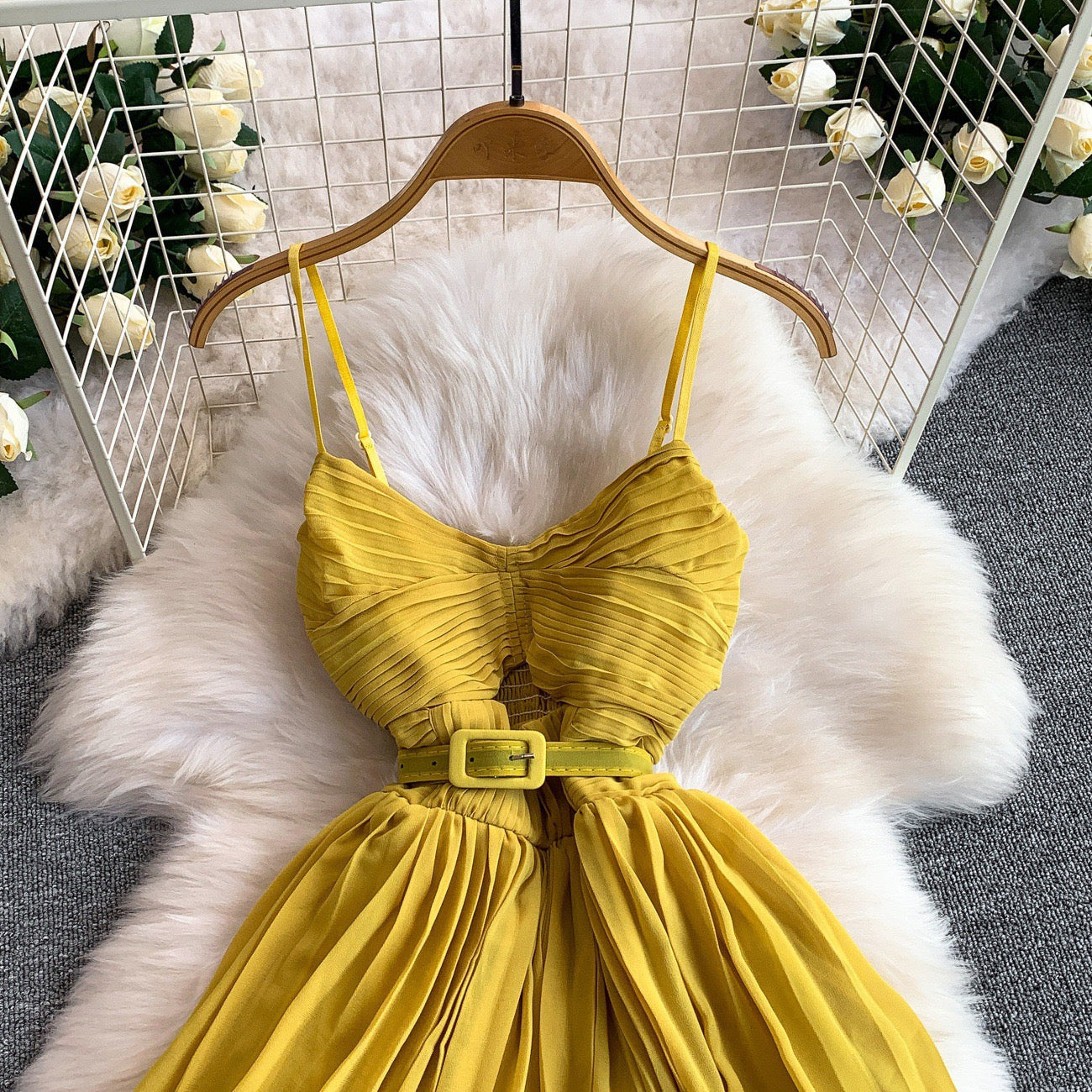 Yellow pleated midi dress with belt