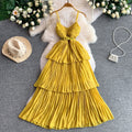 Yellow pleated midi dress with belt